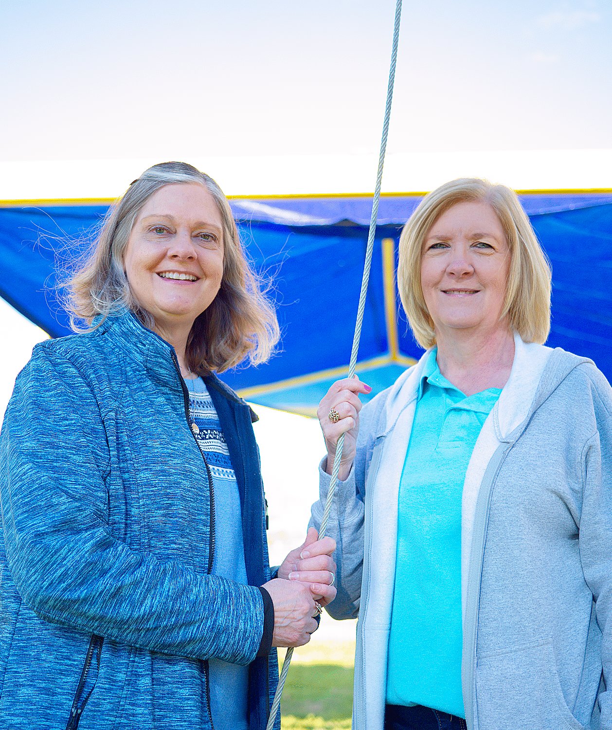 Lisa Bright, manager of the Mineola Civic Center and Becky Moore, who spearheaded the Kiwanis project to bring shade to the splash park, seemed pleased to see the sails come to fruition.